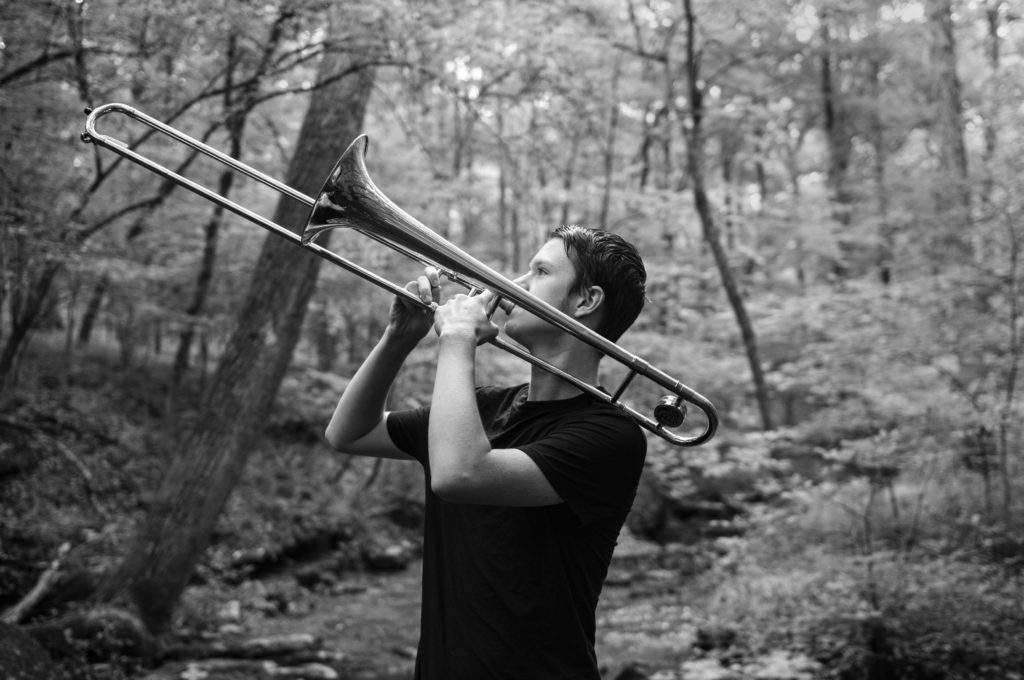 A boy and his horn - playing in Central Tennessee High school Band. At home in the woods.